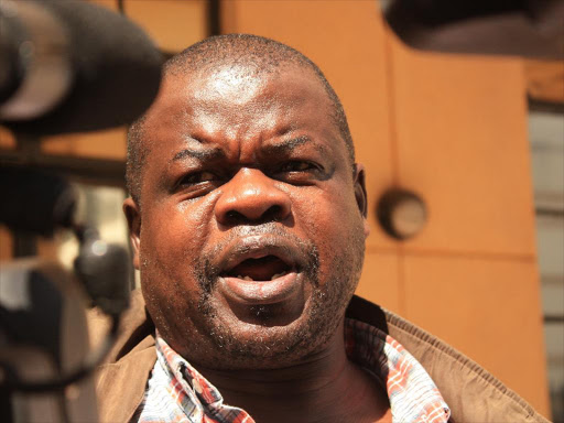 Activist Okiya Omtatah addressing the Media at the Milimani law court Philip kamakya.