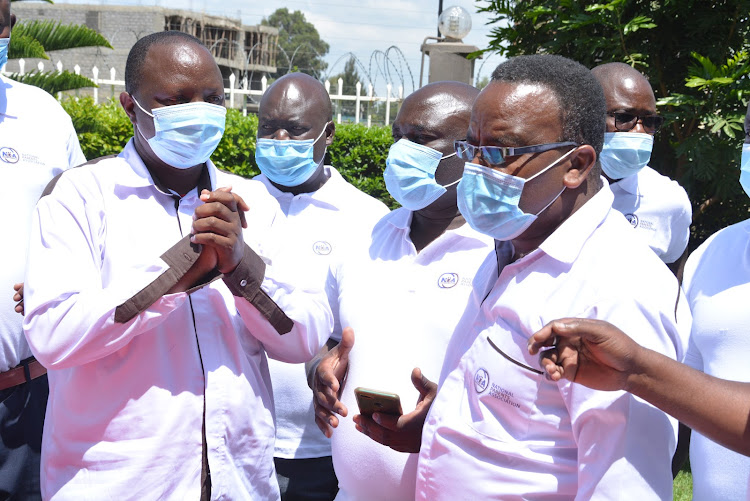 Chairman of the National Parents Association Nicholas Maiyo (L) and members during a meeting in Naivasha on schools' reopening on January 4.