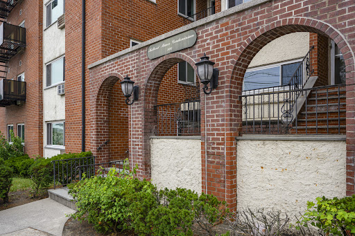 brick apartment building entrance arches lanterns in this luxury house for sale in Yonkers ($2,800)
