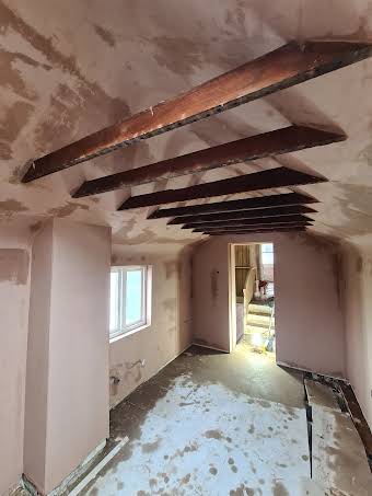 Bathroom renovation displaying old joists album cover