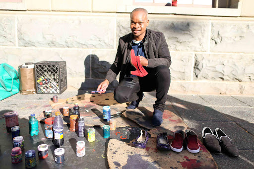 INNOVATIVE: Loyiso dying shoes in inner city East London from Loyiso’s Shoe Shiners Picture: STEPHANIE LLOYD