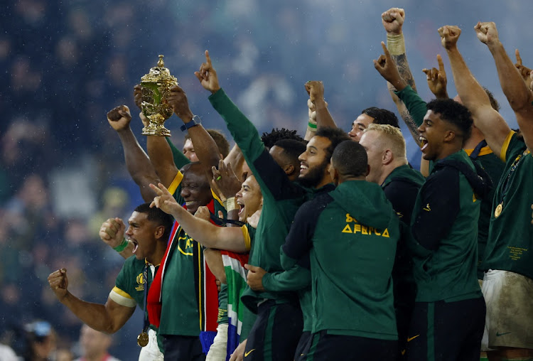 Siya Kolisi lifts The Webb Ellis Cup with teammates and President Cyril Ramaphosa as they celebrate winning the final at the Stade de France in Saint-Denis, France, on October 28 2023 Picture: SARAH MEYSSONNIER/REUTERS