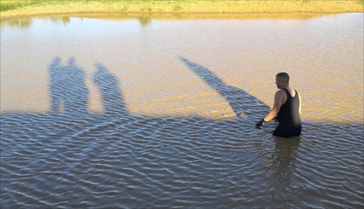 Port Elizabeth Search and Rescue divers searching for the body of little Alipheli Jack,7, who drowned on Sunday during a swimming outing on Sunday afternoon.