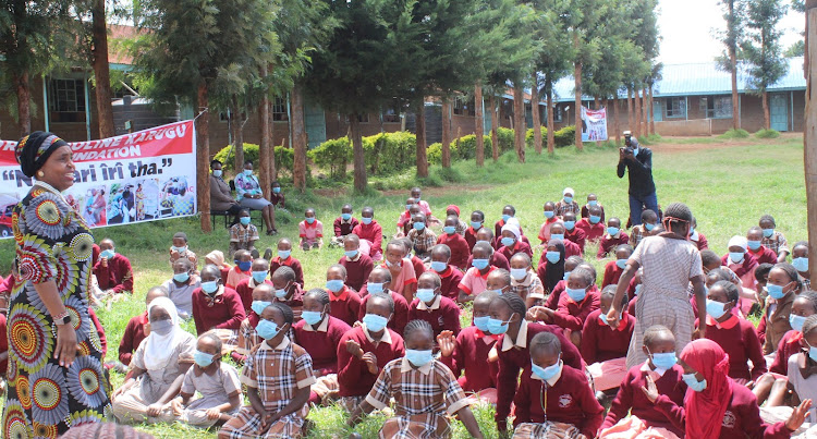 Nyeri deputy governor Caroline Karugu addresses pupils at DEB Muslim Primary School in Nyeri town during celebrations to mark the world menstrual hygiene day on Friday.
