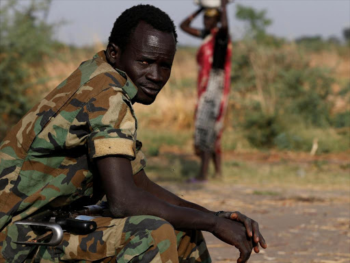 A soldier looks on near the town of Bentiu in Rubkona county, northern South Sudan, February 11, 2017. /REUTERS