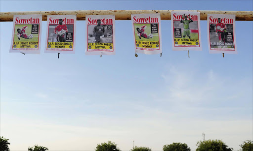 Poster pictures of Senzo Meyiwa hanged on a goal post in Sebokeng. The Bafana Bafana and Orlando Pirates goalkeeper was shot and killed at his girlfriend's house in Vosloorus. Photo Thulani Mbele. 28/10/2014