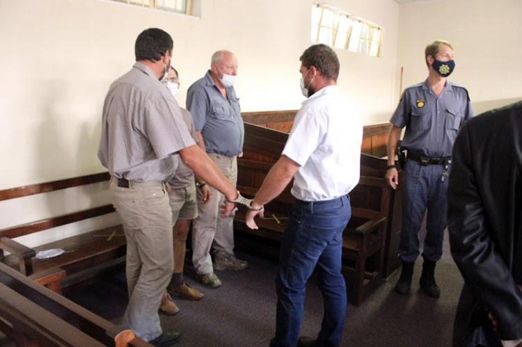 Four Murder accused, Daniel Malan,38, Cornelius Greyling,26, Othard Clingberg,58 and Michael Sternberg,31 Inside the Piet Retief magistrates court on Monday. PHOTOS BY: MANDLA KHOZA