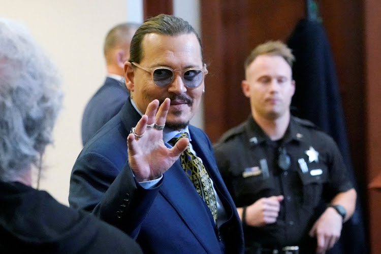 Actor Johnny Depp gestures during his defamation case against ex-wife, actor Amber Heard. The actor's ex-girlfriend will take to the stand in his trial this week.
