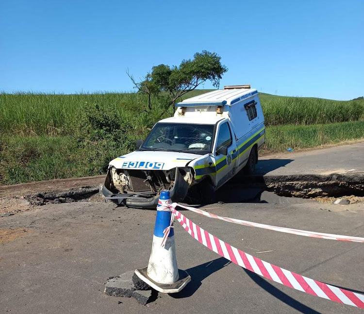 Two police officers were injured and have been hospitalised when their vehicle crashed on the unstable R102 in KwaDukuza, north of Durban.