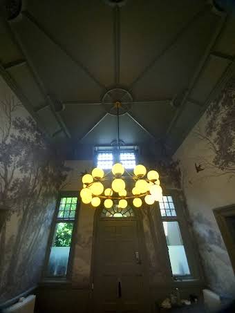 Chandelier install in a listed building. album cover