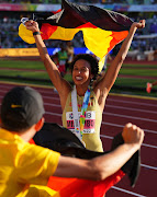 Gold medallist Germany's Malaika Mihambo celebrates after winning the women's long jump final. 