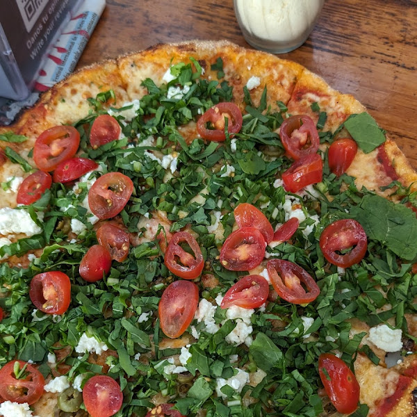 Gluten-free cherry tomato and feta pizza