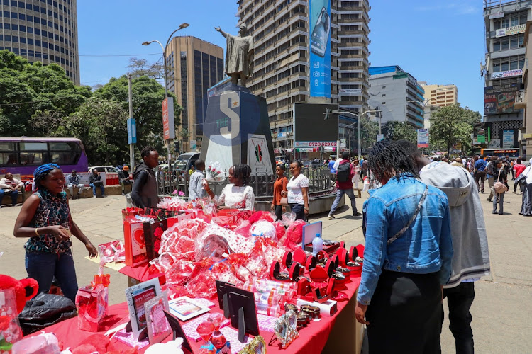 Busy street at Nairobi National Archives as traders displays flowers for sale on February 13, 2023.