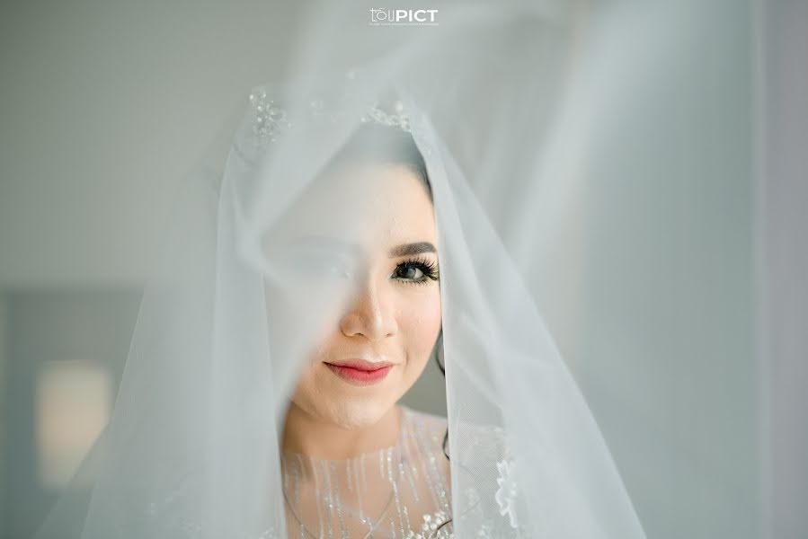 Pulmafotograaf Taufiq Rohmatullah (toupict). Foto tehtud 26 november 2019