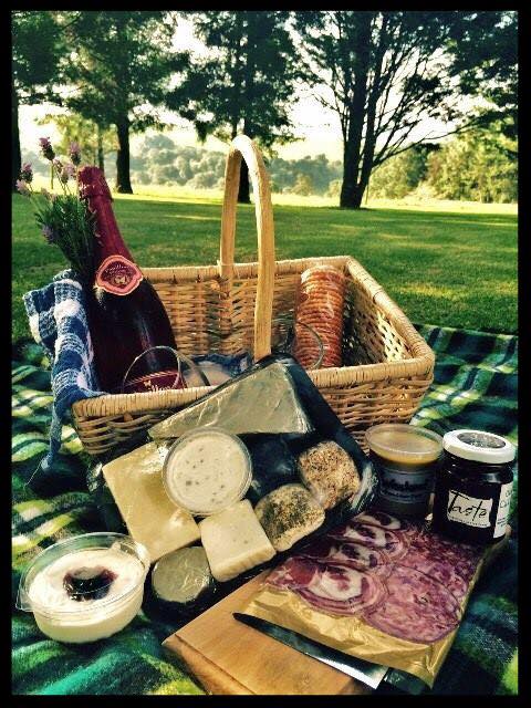 Grad a picnic basket prepared with a selection of cheeses from Swissland Cheese.