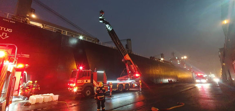 Firefighting reinforcements tackled the blaze after the ship was allowed to dock in Cape Town.