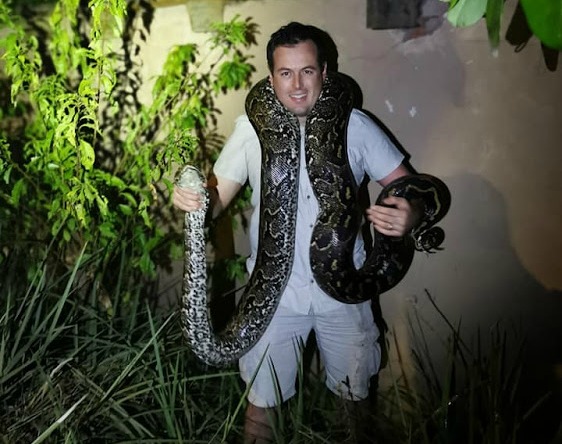 Snake conservationist Nick Evans with the massive 3.9m python found on a busy road in Waterfall, Durban.