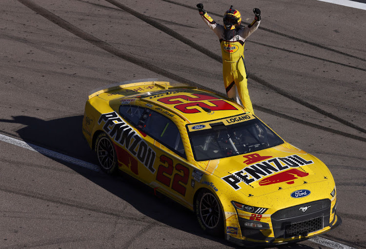 Joey Logano celebrates after winning the NASCAR Cup Series South Point 400 at Las Vegas Motor Speedway on October 16 2022 in Nevada.