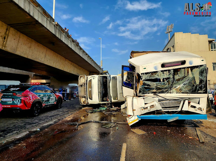 Rescue teams worked for more than an hour to free a bus passenger, who was “severely entrapped” in the wreckage.