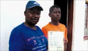 NOT FUNNY: Peter and Motsumi Shumba display the death certificate that was issued instead of an identity document. © Sowetan.