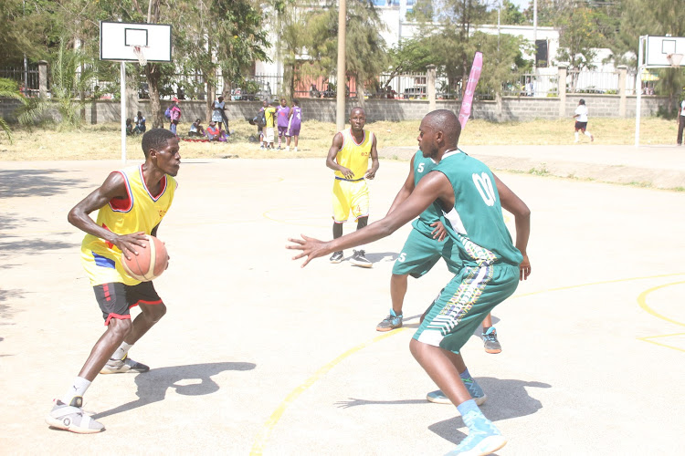 Action in the men's basketball game between Turkana (L) and Vihiga.