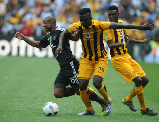 Thabo Qalinge of Orlando Pirates tackled by Kgotso Moleko of Kaizer Chiefs during the Nedbank Cup, Last 32 match between Orlando Pirates and Kaizer Chiefs at FNB Stadium on March 05, 2016 in Soweto, South Africa. (Photo by Lee Warren/Gallo Images)