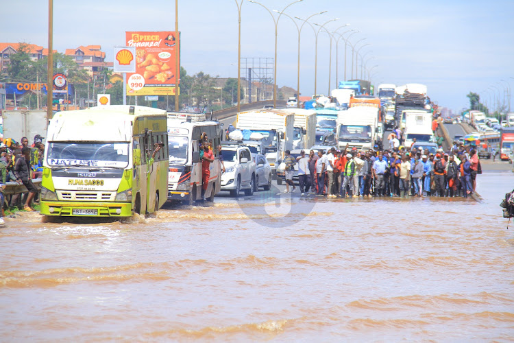 Vehicles wade through flooded Thika Super Highway on May 1, 2024.