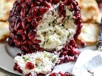 Pomegranate Jeweled Cheeseball was pinched from <a href="http://www.howsweeteats.com/2013/12/pomegranate-jeweled-white-cheddar-toasted-almond-and-crispy-sage-cheeseball/" target="_blank">www.howsweeteats.com.</a>