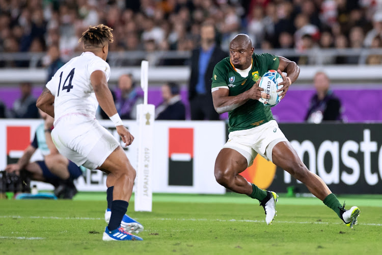 Mazakole Mapimpi of South Africa runs with the ball during the Rugby World Cup 2019 Final match between England and South Africa.