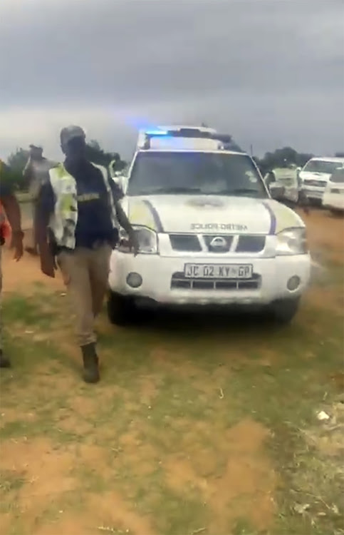 A video emerged in which Tshwane Metro police officers are seen holding a man in front of an official vehicle and then driving over him.