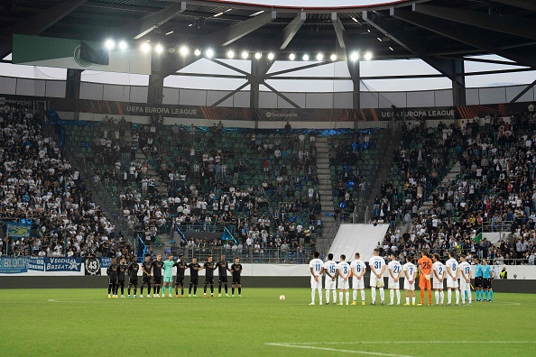 FC Zurich's and Arsenal's players line up during a minute of silence following the announcement of the death of Britain's Queen Elizabeth II ahead of the Uefa Europa League Group A first leg football match at Kybun Park stadium in St Gallen on September 8 2022.