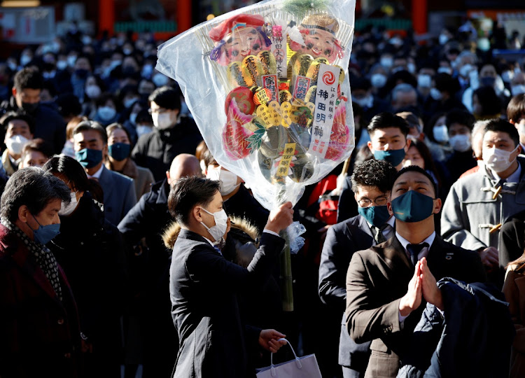 A new year rake or kumade, decorated with imitation gold coins at the Kanda Myojin shrine in Tokyo, Japan. Picture: ISSEI KATO/REUTERS