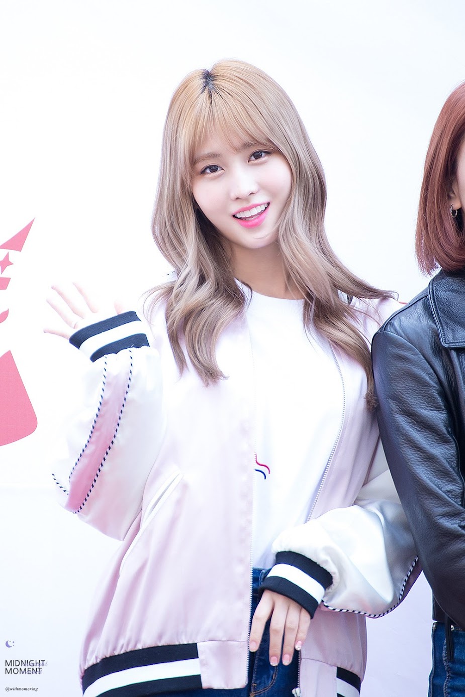 Image: Momo from TWICE wearing the same bomber as Seulgi / Fan taken by @withmomoring