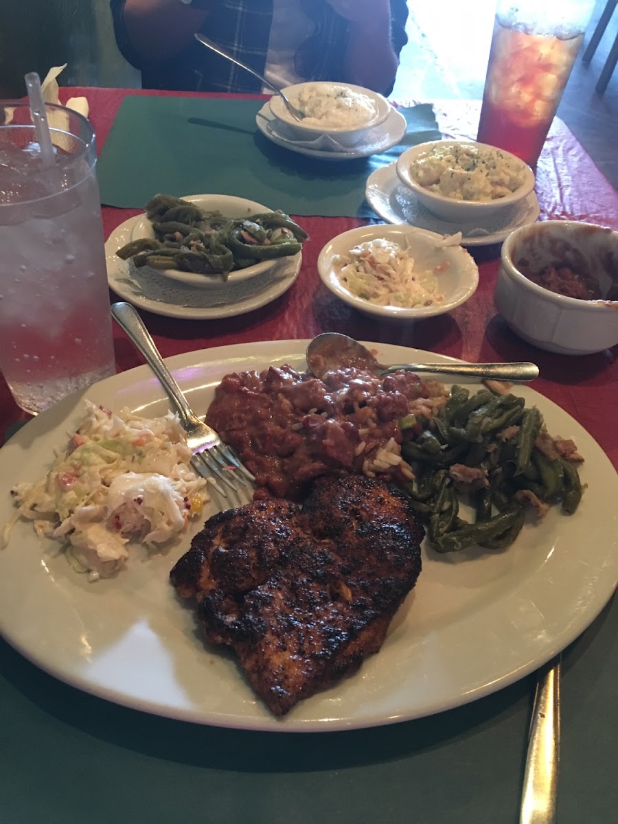 Bronzed Chicken with coleslaw, green beans, red beans & rice, Gouda Grits, and   macaroni salad.   Everything was delicious!