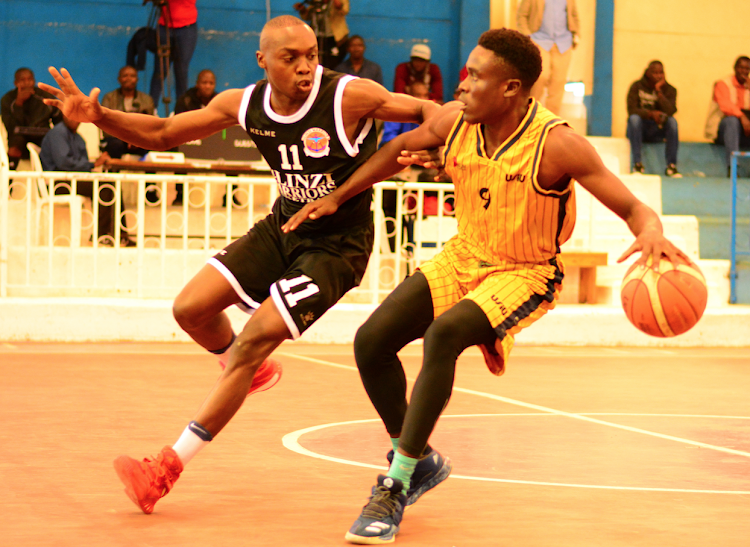 Ulinzi warriors' Erick Mutoro (L) challenges Ariel Ortega of USIU during a Pemier League match