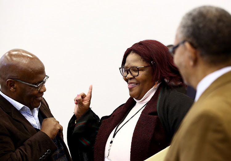 Former ANC MP, Vytjie Mentor laughs with Advocate Muzi Sikhakhane, former president Jacob Zuma's lawyer, during a break at the state capture commission in Parktown, Johannesburg.
