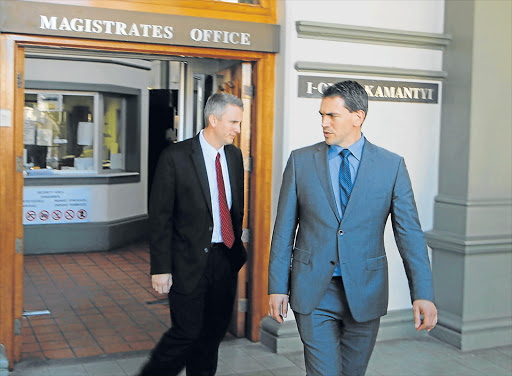 LONG GAME: Two members of the American Federal Bureau of Investigation team that arrested a Grahamstown man suspected of online child pornography leave the court yesterday Picture: DAVID MACGREGOR