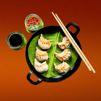 Steamed Chicken Schezwan Momo [7pcs]