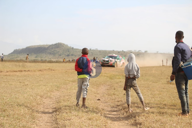 Kenyans watching the WRC Safari Rally 2024 1st round at Elementaita Soysambu view point on March 30, 2024.