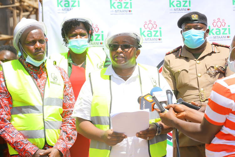 Housing and Urban Development PS Charles Hinga speaking at Nyansiongo when he launched registration for the third phase of Kazi Mtaani