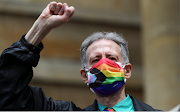 Veteran British LGBT rights campaigner Peter Tatchell wearing a face mask takes part in the Gay Liberation Front (GLF) pride march in London, Britain, on June 27 2020. 
