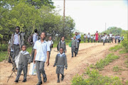 DANGEROUS: GRADE R pupils from Tambaulate village near Thohoyandou, Limpopo, walk long distance to get an education. PHOTO: Elijar Mushiana