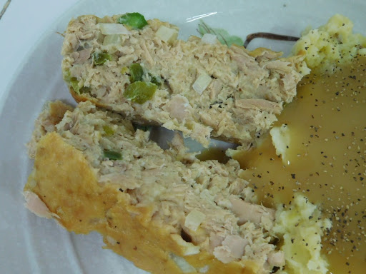 Tuna Loaf with side of potatoes and gravy.