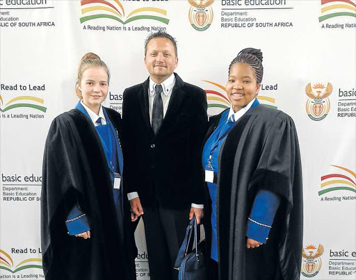 WELL DONE: Catelyn Cumberlege and Thando Mtombeni did well at the Moot Court. They are with teacher Ryno Simms Picture: SUPPLIED