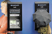 ATMs at a branch of Barclays. File Photo.