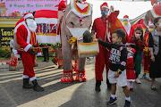 Thai elephants dressed as Santa Claus deliver face masks to children at the Jirasat Wittaya elementary school on December 23, 2020 in Phra Nakhon si Ayutthaya, Thailand. 