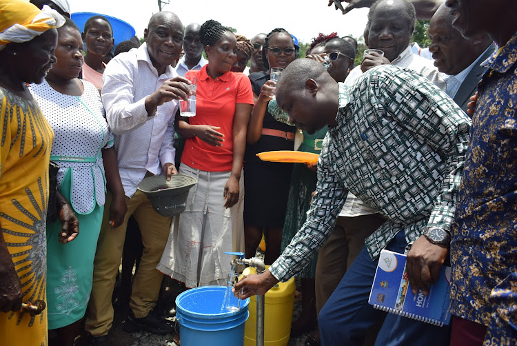 Suba South MP Caroli Omondi and residents during the launch of water project at Uterere market in the constituency on March 20,2024