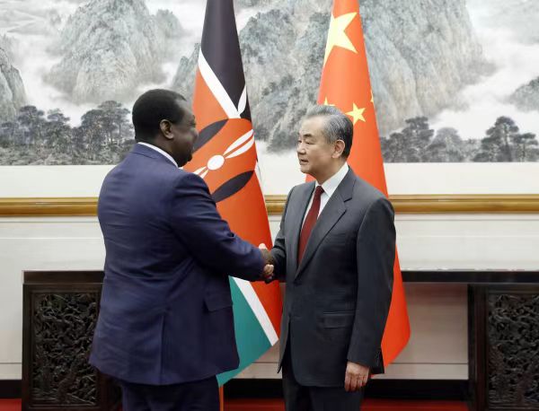 Chinese Foreign Minister Wang Yi with the Prime Cabinet Secretary and Cabinet Secretary for Foreign and Diaspora Affairs Musalia Mudavadi in Beijing on Thursday.