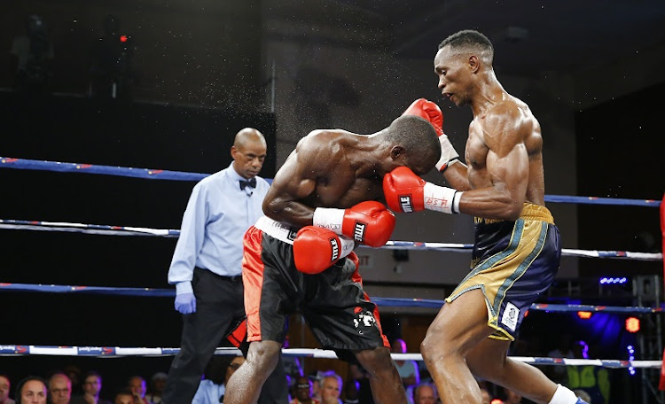 Tshifhiwa Munyai, right on his way to stopping Osgood Kayuni in four rounds in their lightweight bout last weekend.