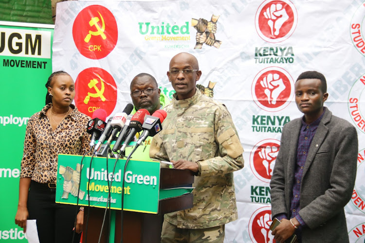 United Green party Movement chairman Agostino Neto speaks flanked by UGM National campaign spokesperson Sialo Tasur(L) Kenya Tuitakayo Movement national coordinator Patrick Ochieng and National Students Caucus spokesperson Joku Justice during a press briefing at party's headquarters Westlands on Wednesday 28, July./WILFRED NYANGARESI